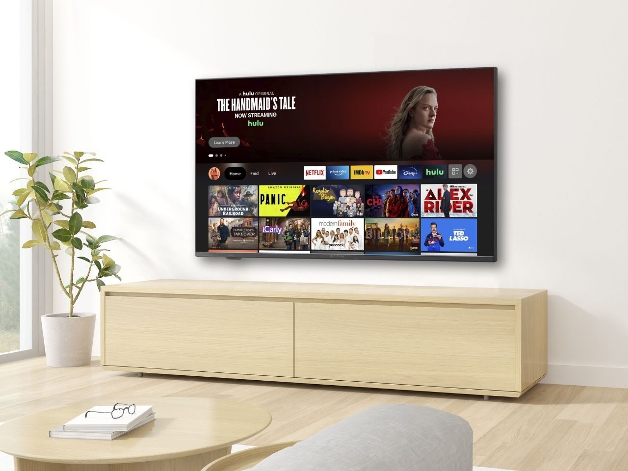 Insignia 50-inch TV mounted on a living room wall.