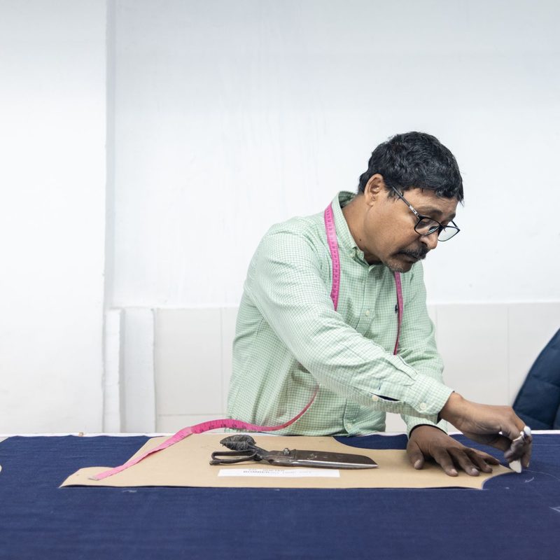 A Man Making Clothing.