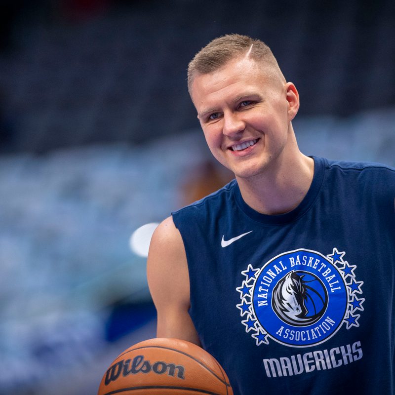 Kristaps Porzingis with a basketball on his hand.