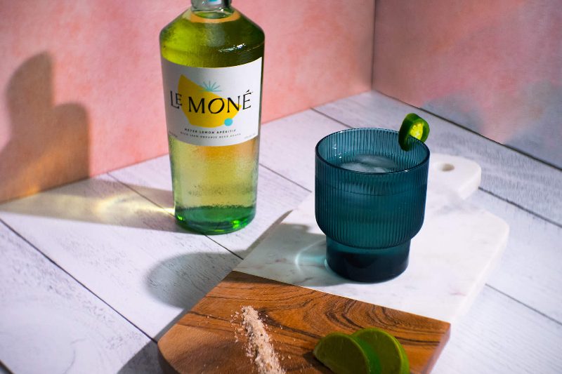 Bottle of Le Mone spirit and a margarita.