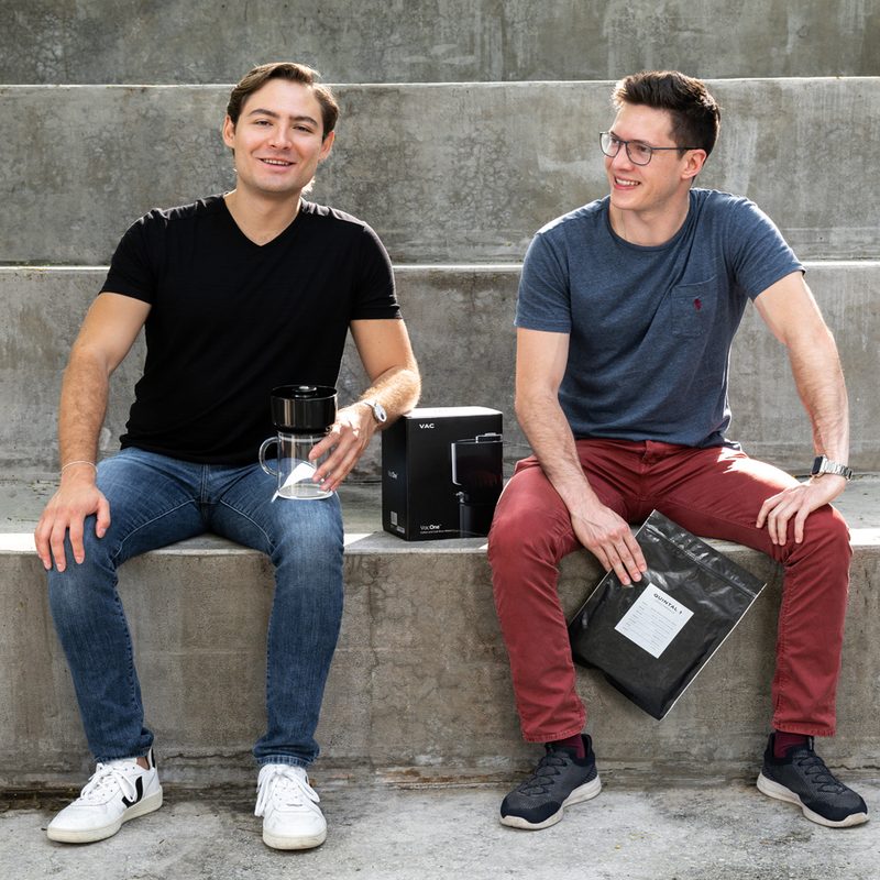 Otto Becker and Eduardo Umaña of Quintal Coffee sitting on the stairs.