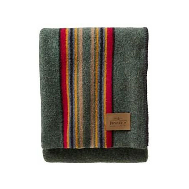A striped green woolen blanket from Pendleton on plain background
