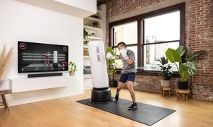 Man boxing with Fightcamp workout.