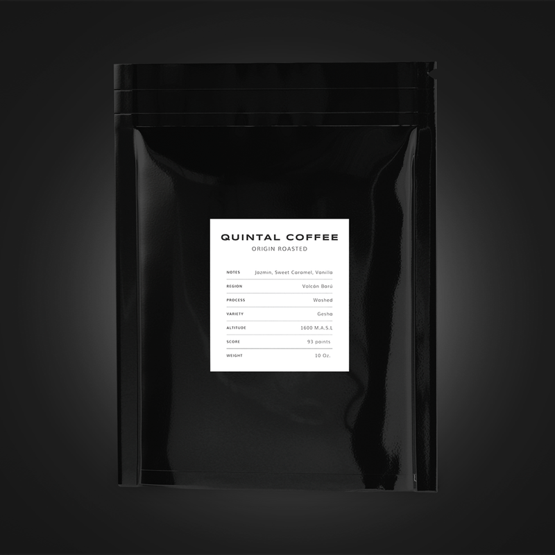 A pack of Quintal Coffee coffee beans against a black background.