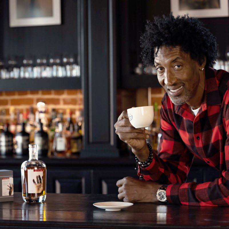 Scottie Pippin holding a tea cup.