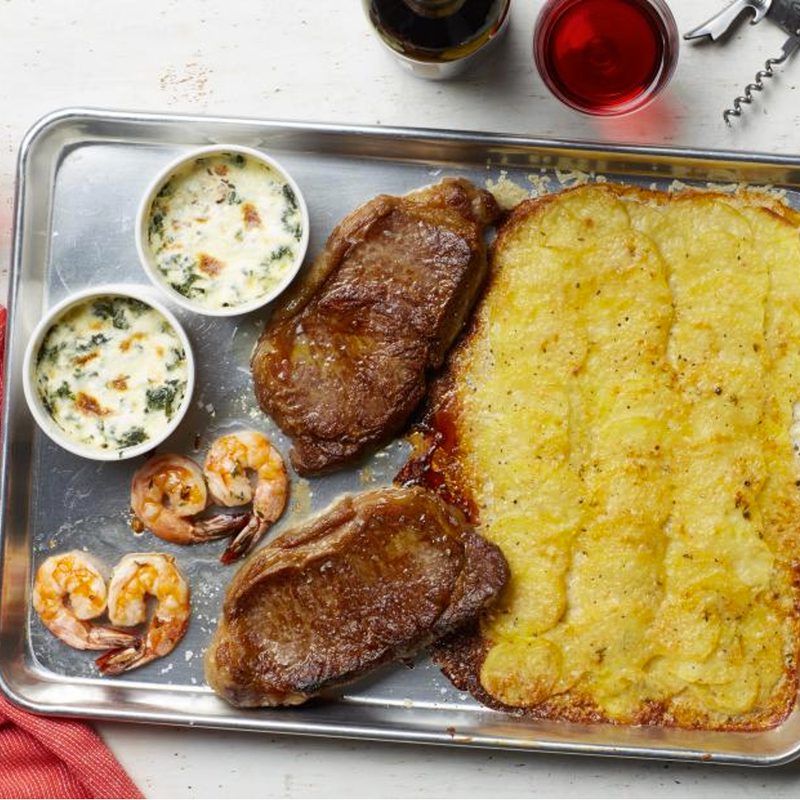 Steak, Shrimp and Potatoes on a baking sheet.