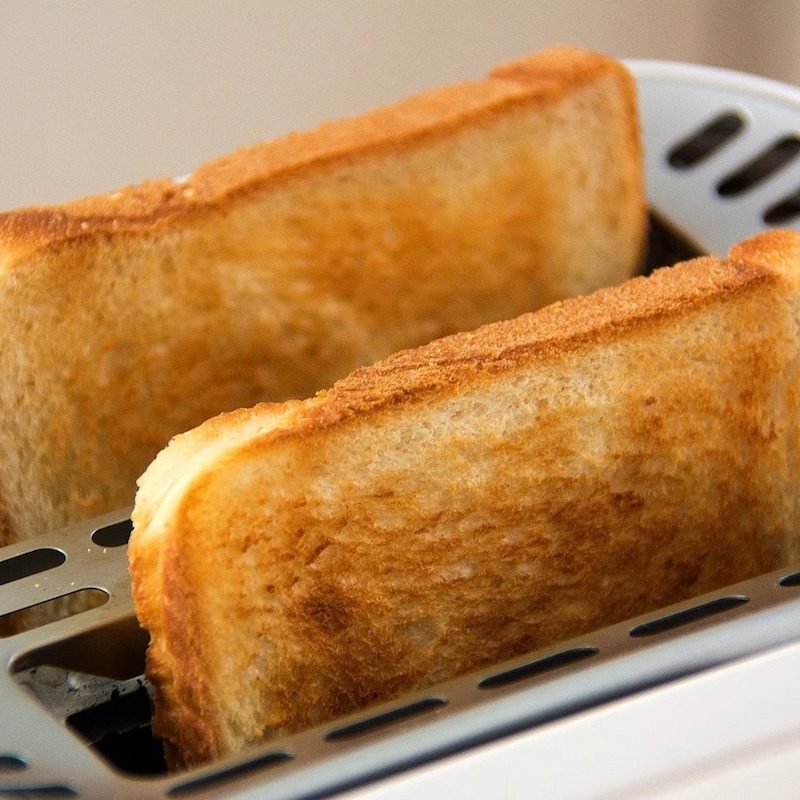 Toast popping out of a toaster.