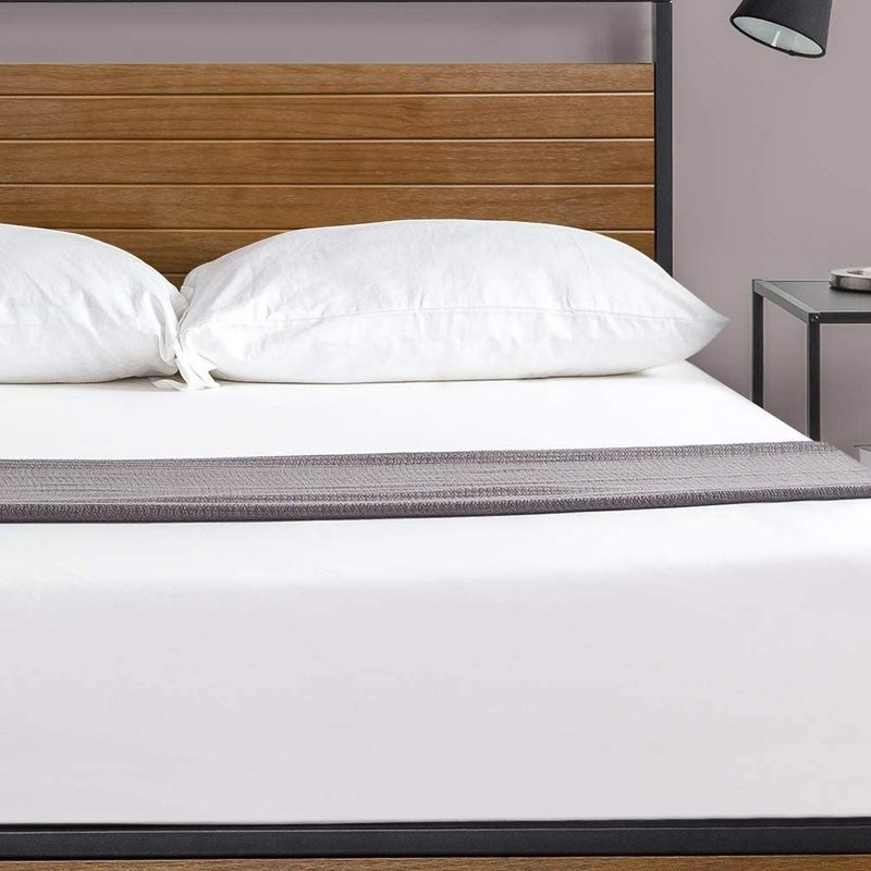 The Zinus Suzanne Platform Bed Frame with a white mattress and modern nightstand on the side.