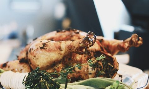 A whole roasted chicken served on a plate