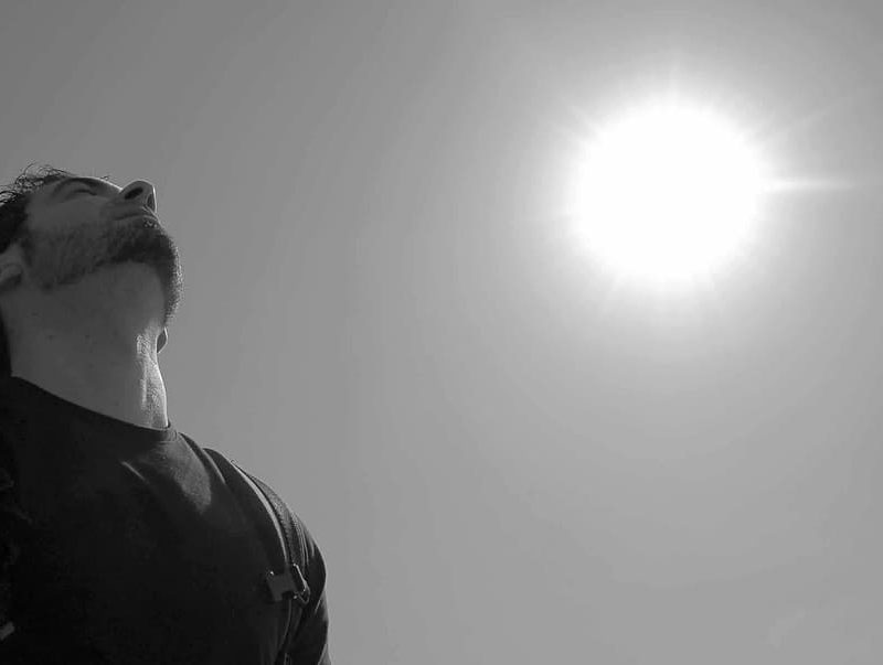 A man breathing under the sun