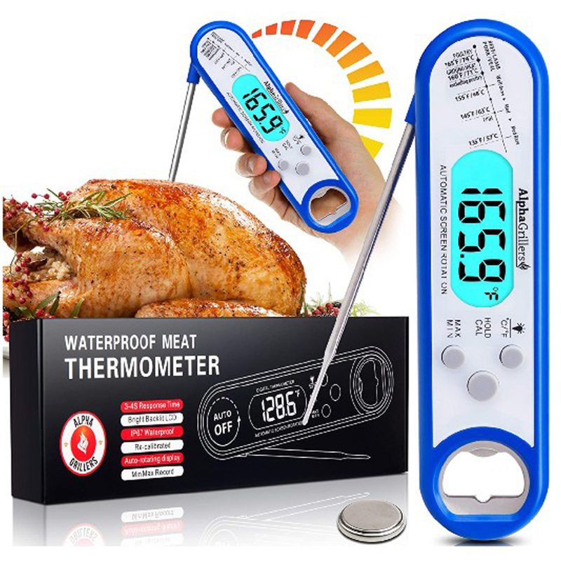 An Alpha Grillers Meat Thermometer with its packaging and a hand using it on a whole chicken in the background.