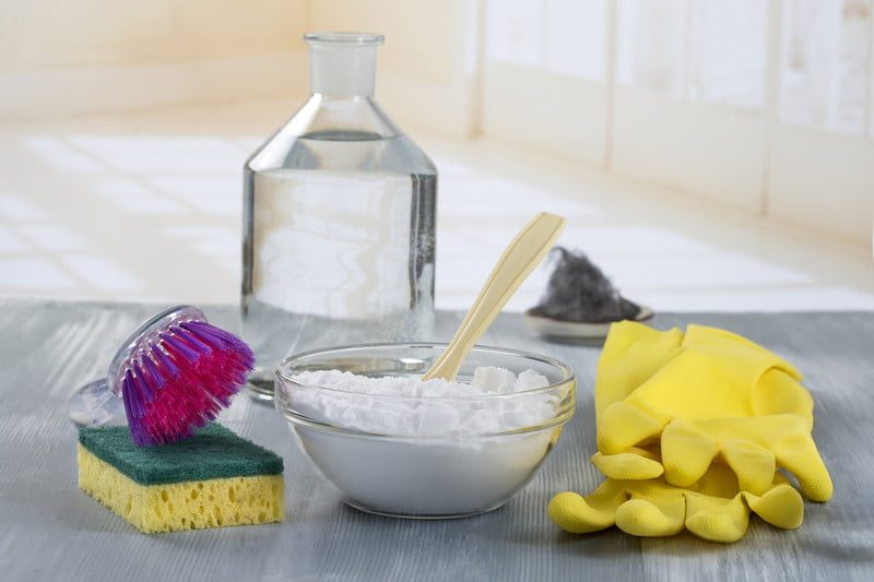 Vinegar, baking soda, sponge, and gloves