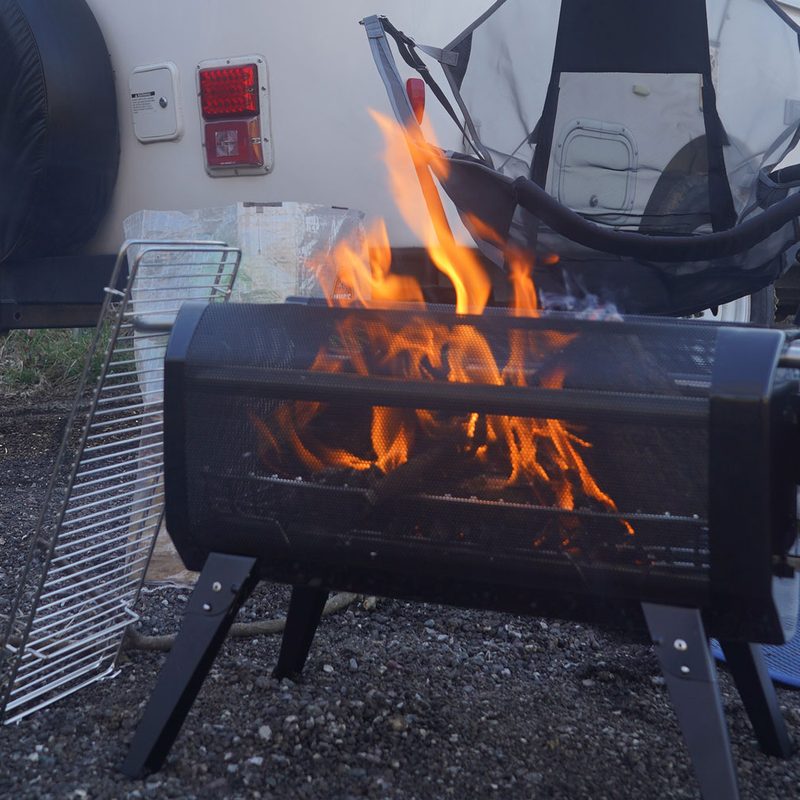 BioLite FirePit+ at the rear of a small white travel trailer.