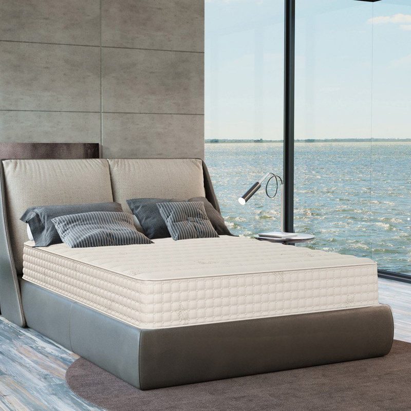 The PlushBeds Botanical Bliss Organic Latex mattress in a bedroom.