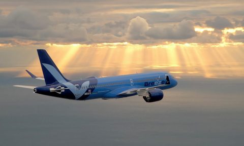 A Breeze Airlines A220 jet in flight.