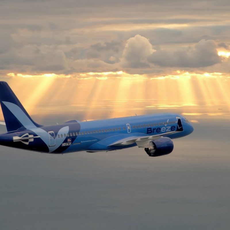 A Breeze Airlines A220 jet in flight.
