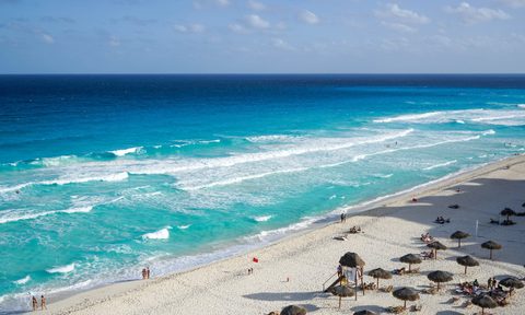 Palapas at the beach in Cancun, Mexico.