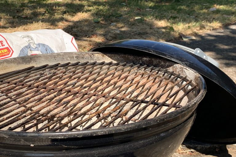 A dirty grill grate ready for cleaning