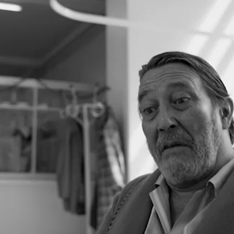 A close-up of Ciarán Hinds in a scene in Belfast.