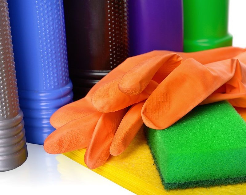 rubber gloves and sponge for cleaning a tent.