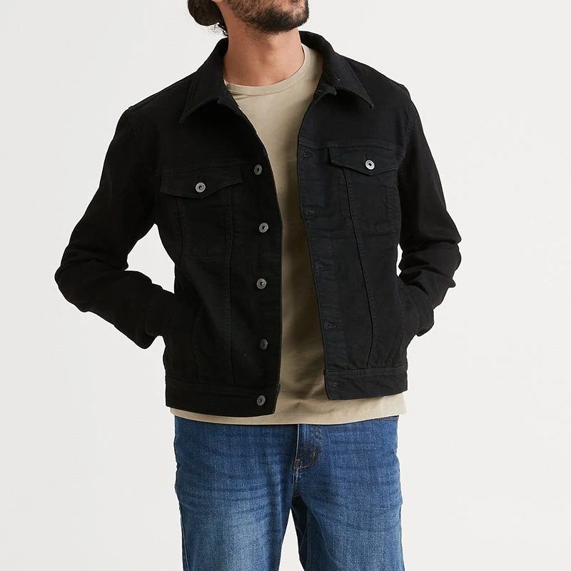 A model wearing the Duer Performance Denim Stay Dry trucker jacket.