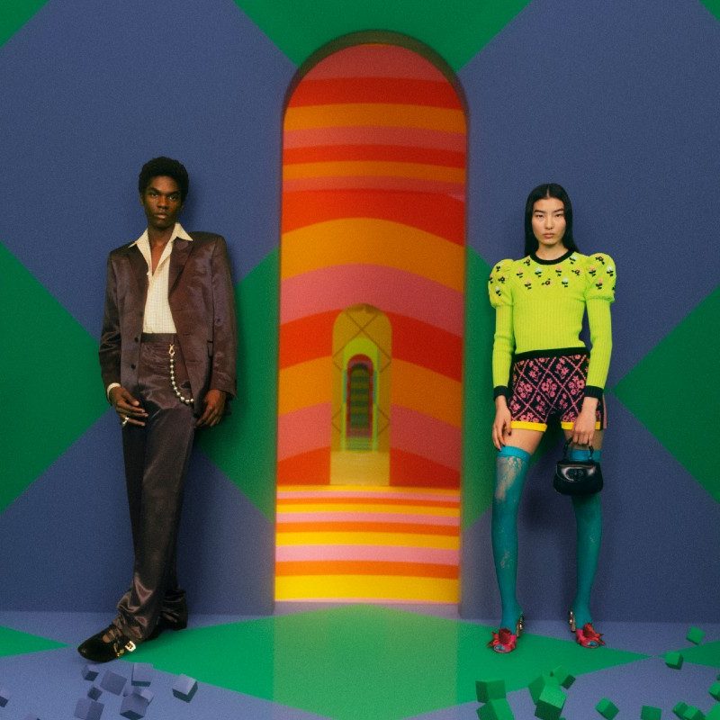 Gucci models stand at the entrance to the Vault, the luxury apparel company's new metaverse venture offering vintage goods.