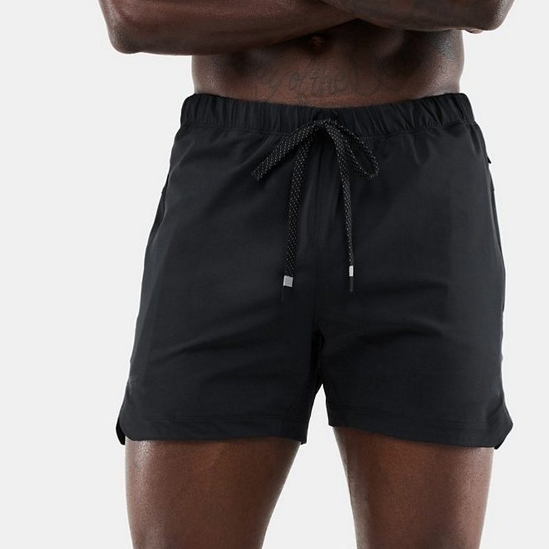 A Fabletics The One short on shirtless model.