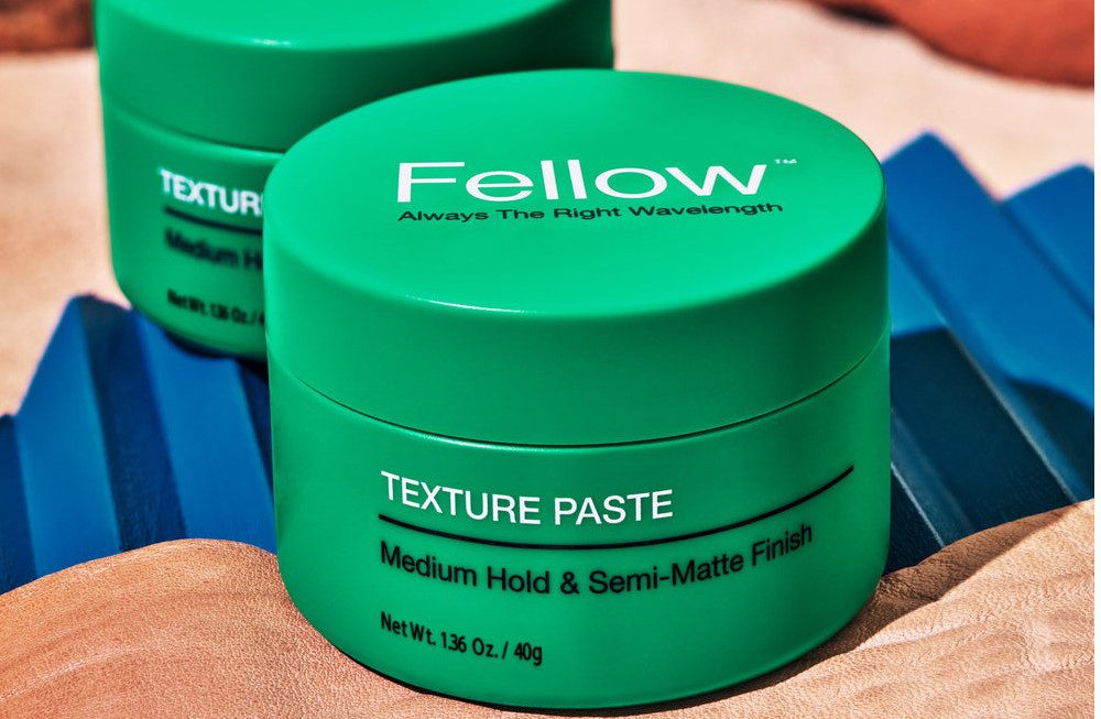 Two containers of Fellow Barber Texture Paste.