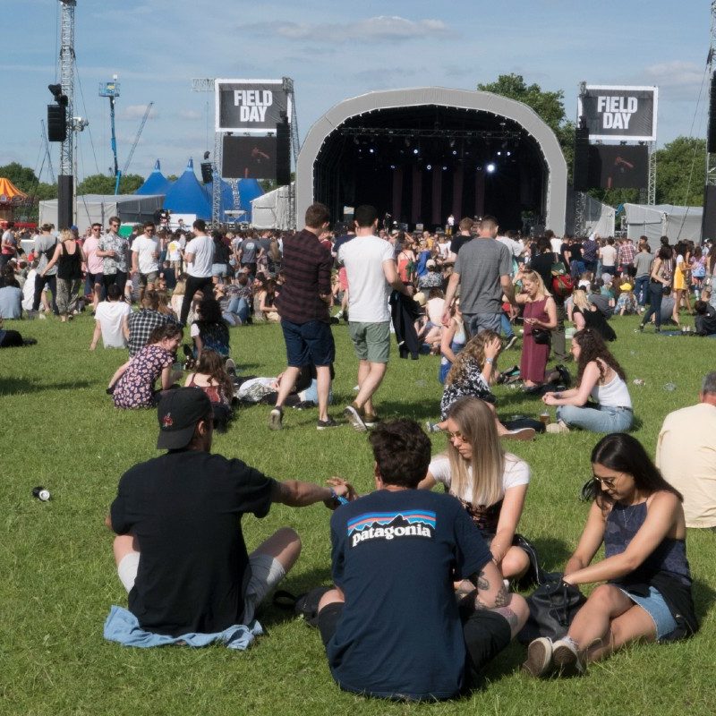 Hipster revelers gather on the Victoria Park grass at Field Day, 2017 in London.