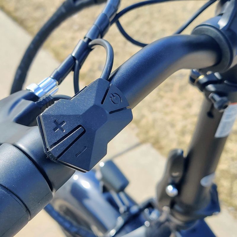 A close-up of the handlebar buttons on the Lectric XP 2.0 Black electric bike.