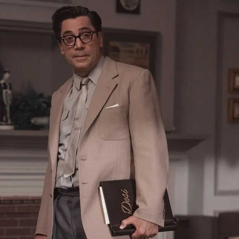 Javier Bardem holding a binder in Being the Ricardos.