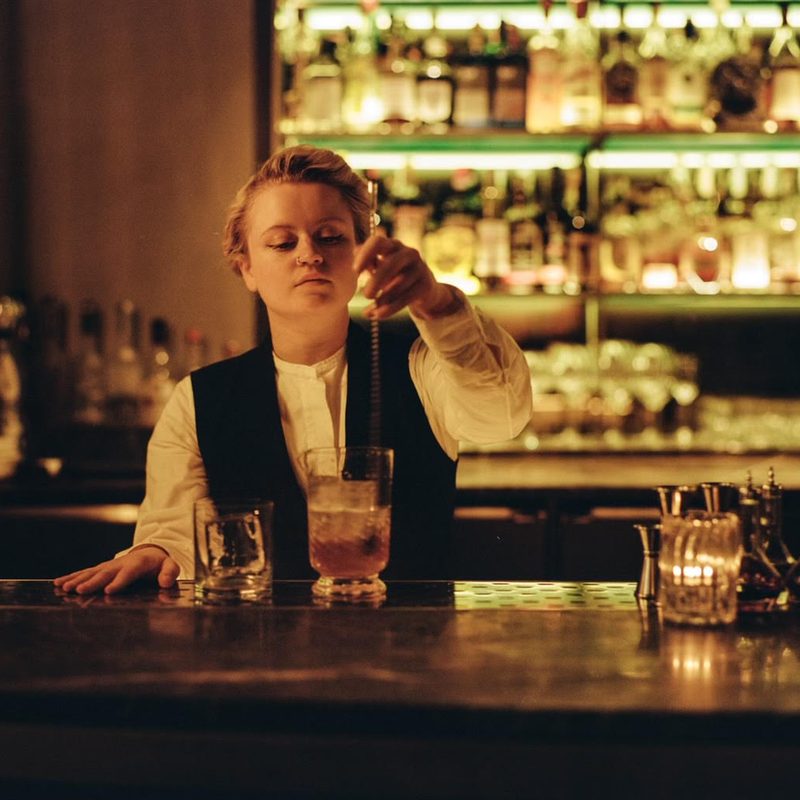 Bartender Kat Foster stirring a cocktail