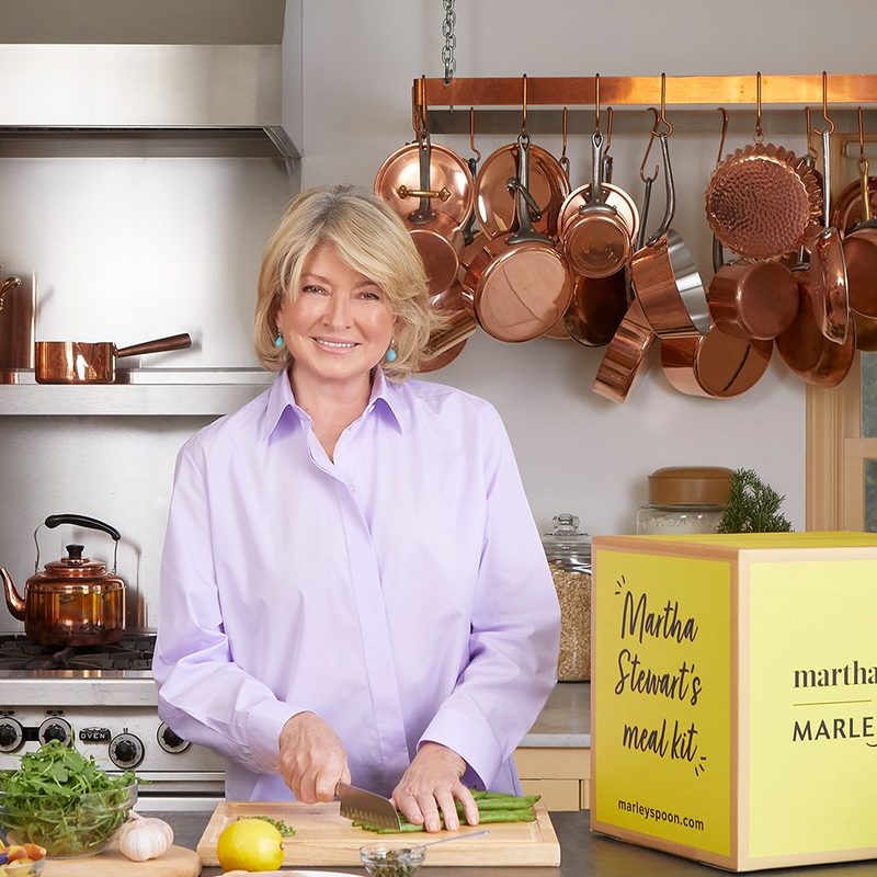 Martha Stewart chopping food next to a Martha Stewart & Marley Spoon box.