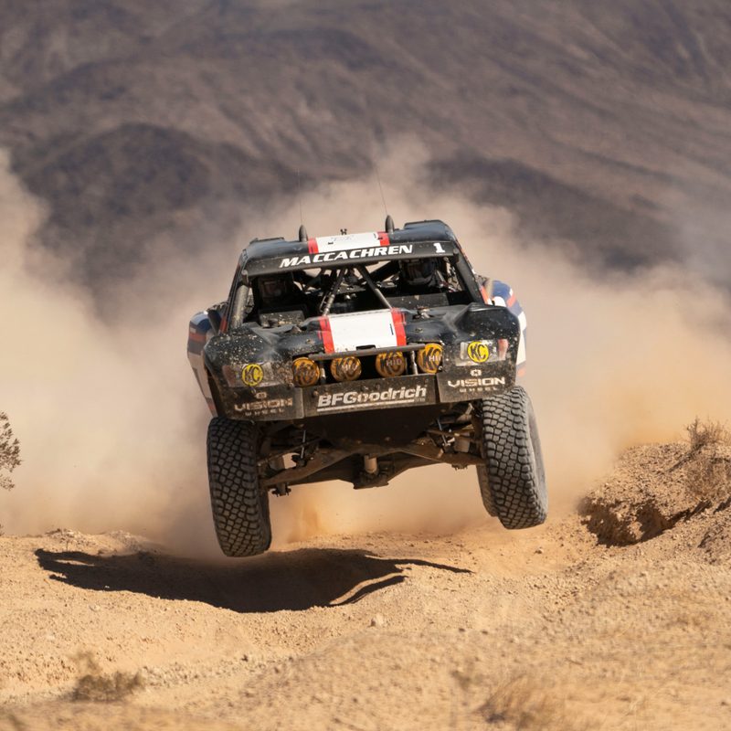 Trophy truck running over whoops at the Mint 400 desert race.