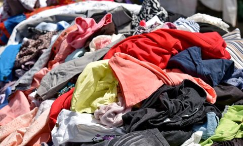 A pile of multi-patterned textiles.