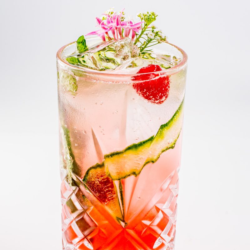 A Pretty in Pink cocktail on plain background