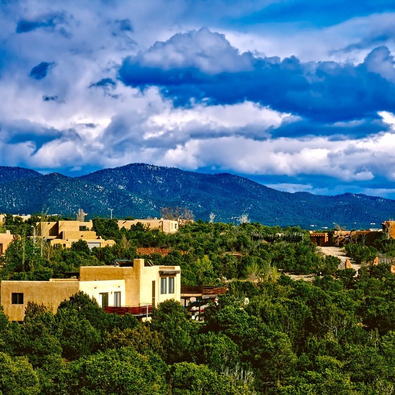 The cloudy sky over the mountains and hills of Santa Fe, New Mexico