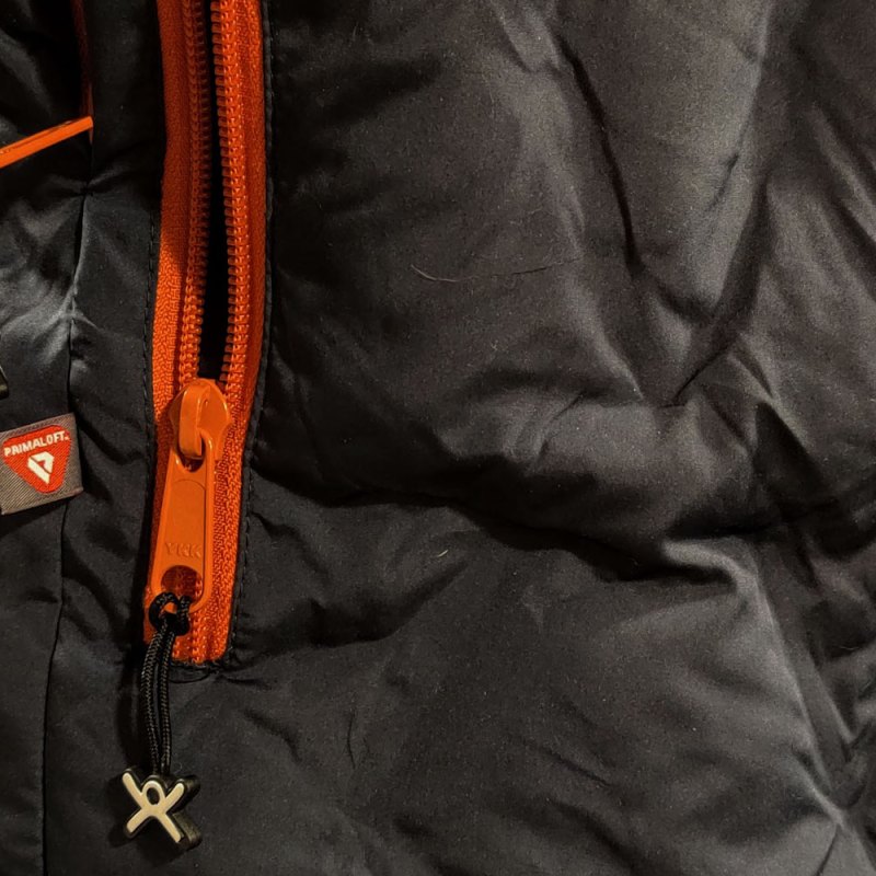 Closeup of zipper pocket on the Selk'bag Nomad wearable sleeping bag.