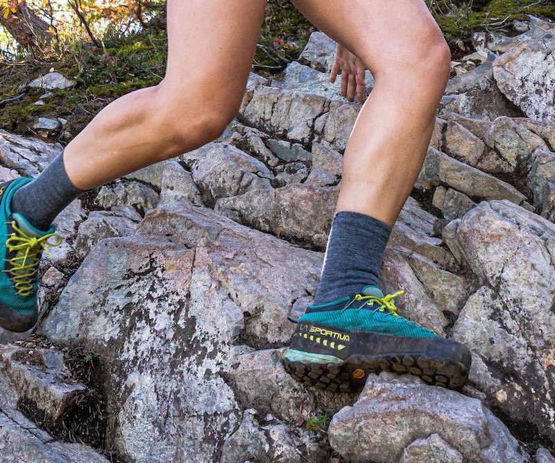 Trail runner wearing swiftwick flite xt trail socks.