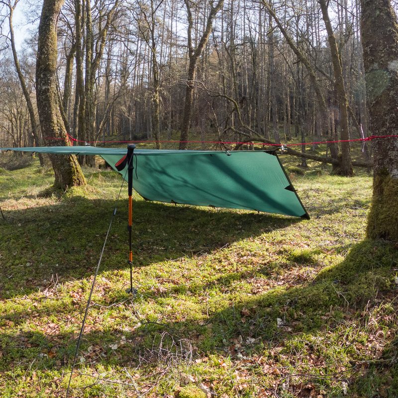 A lean-to style tarp shelter with a long cover