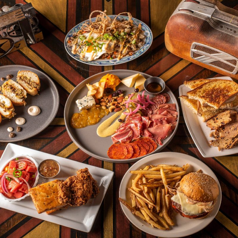 An overhead shot of delicious dishes and two radios.