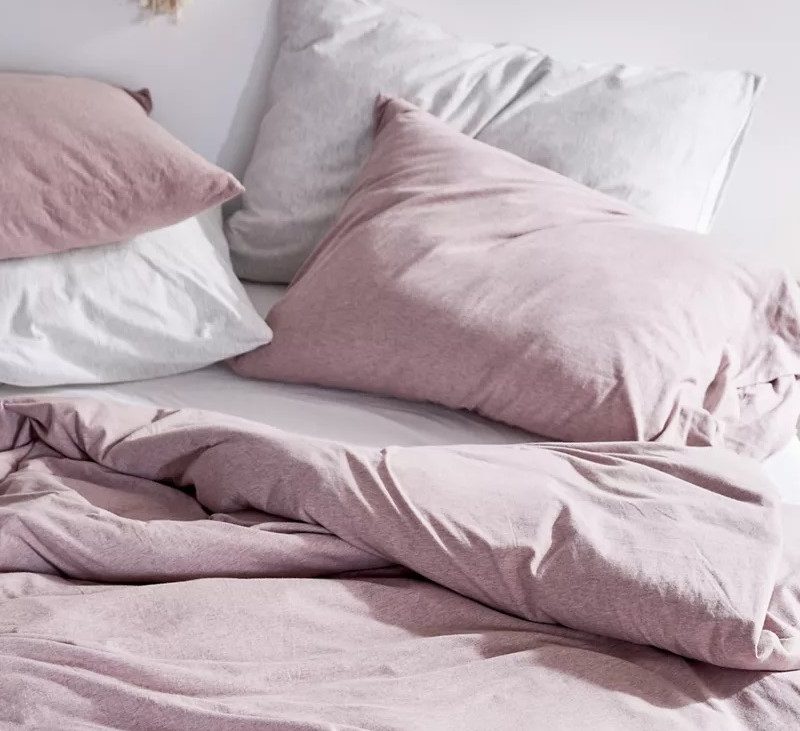 Urban Outfitters Heathered Jersey Duvet Set in spring colors.