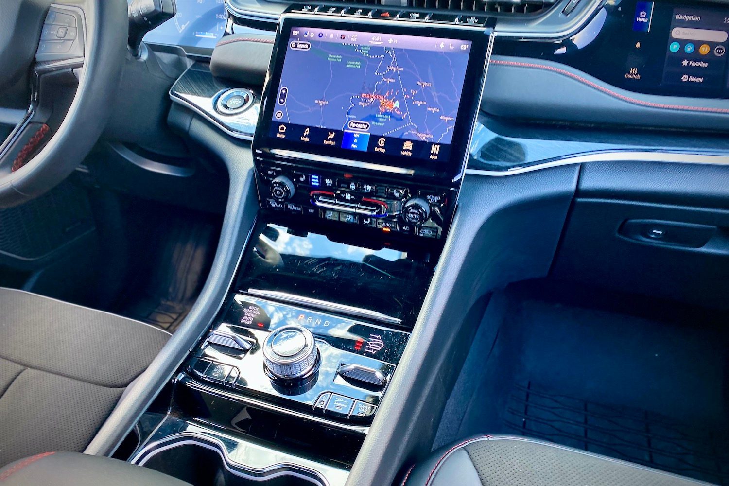 Close up of 2022 Jeep Grand Cherokee Trailhawk center console from passenger's side.