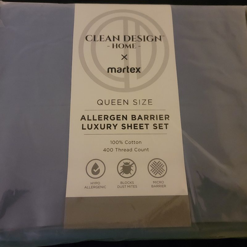 A set of slate blue Clean Design Home x Martex bed sheets in its original packaging.
