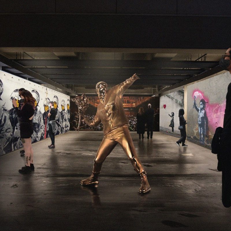 'Man with Flowers' centers this view of the new 'Banksyland' exhibit in Portland, traveling across the United States.