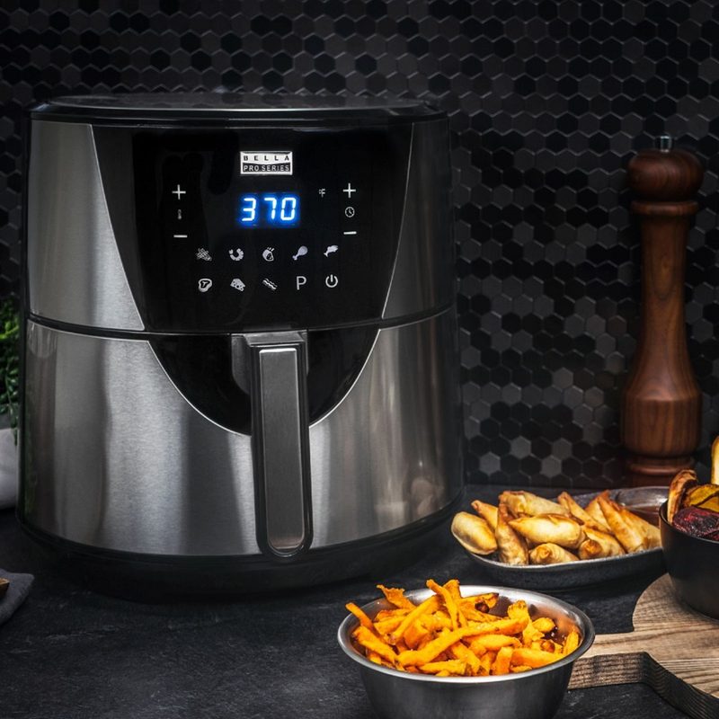 The Bella Pro Series 8-Quart Digital Air Fryer with some fried food at the side.