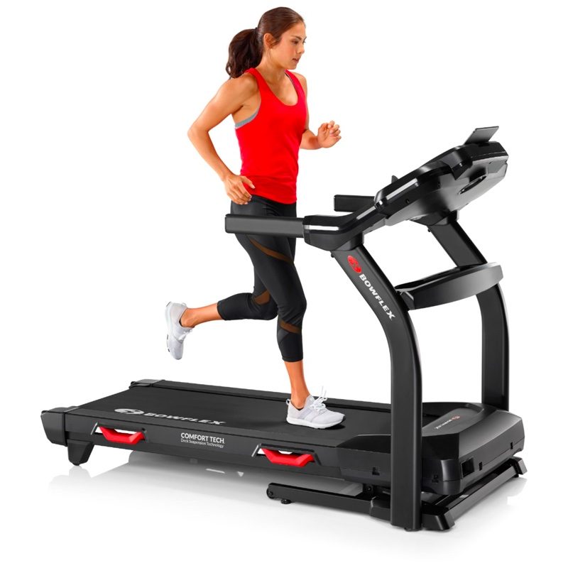 A woman runs on her BXT6 treadmill.
