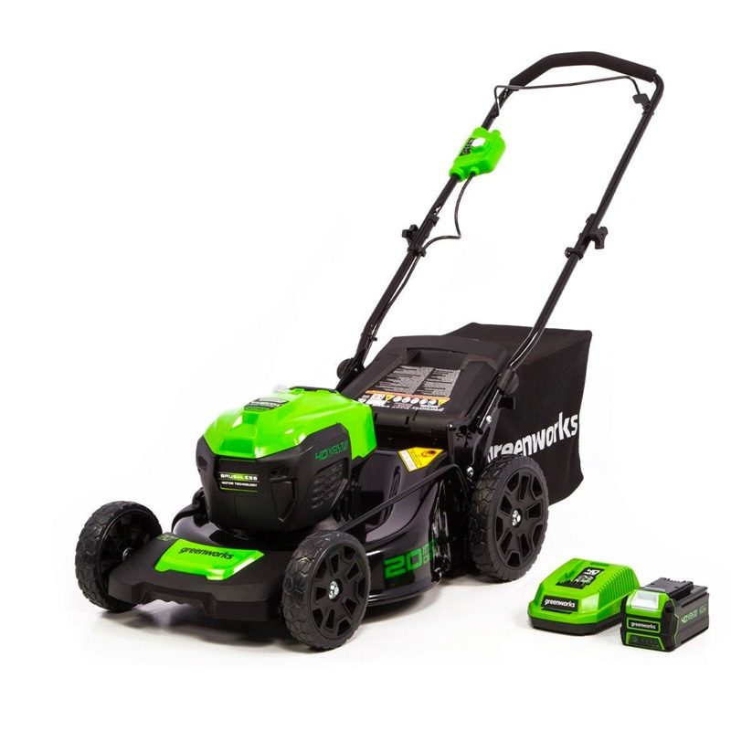 The Greenworks electric 20-inch lawn mower sits next to it rechargeable 40-volt battery and charger.