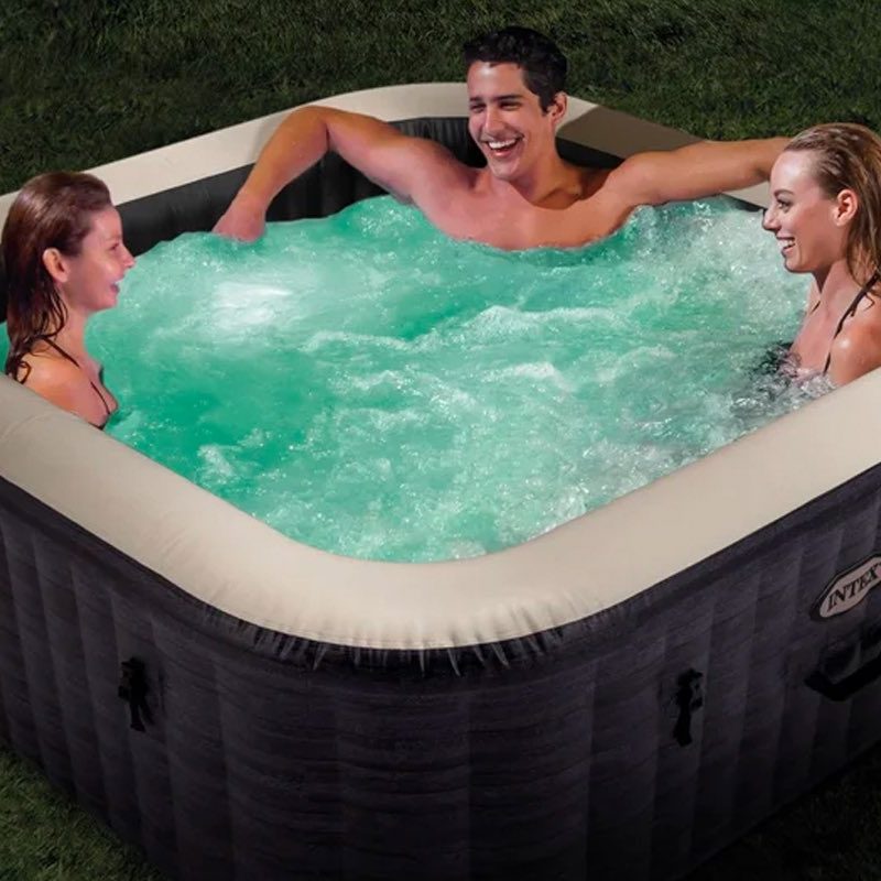 Friends enjoy the Intex PureSpa Plus inflatable hot tub.