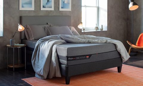 A Layla Hybrid mattress sits in a bedroom.